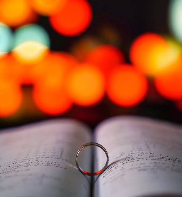 An open book with abstract symbols representing yoga philosophy.